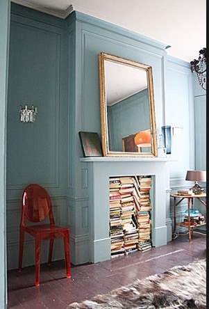 Fireplace filled with books