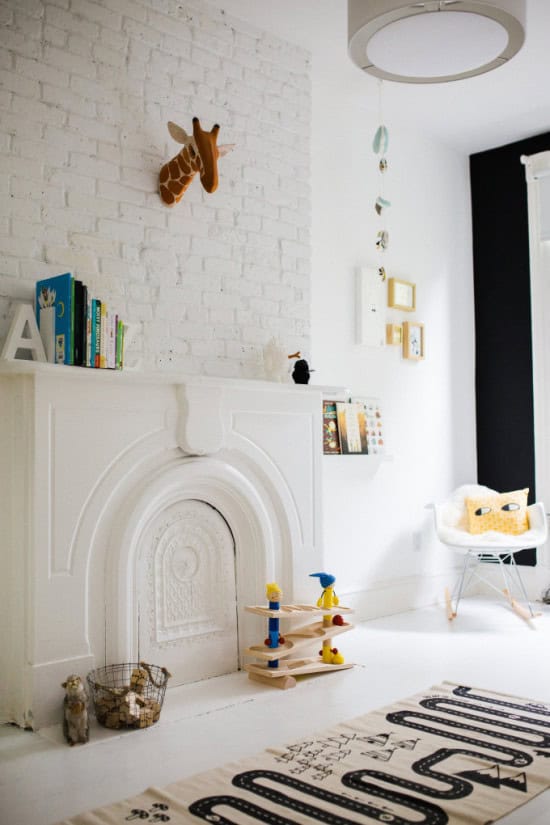 fireplace and white brick wall