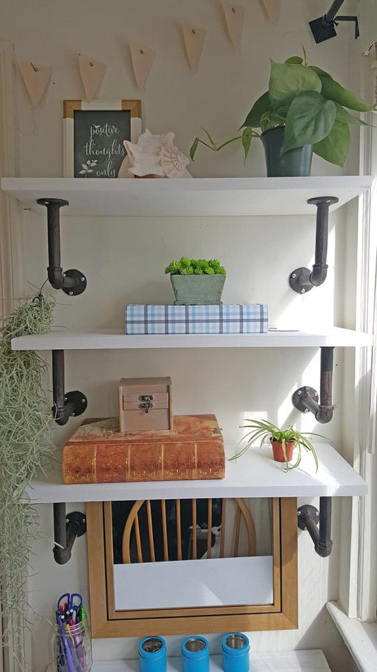 small desk space with diy shelves that also doubles as a vanity