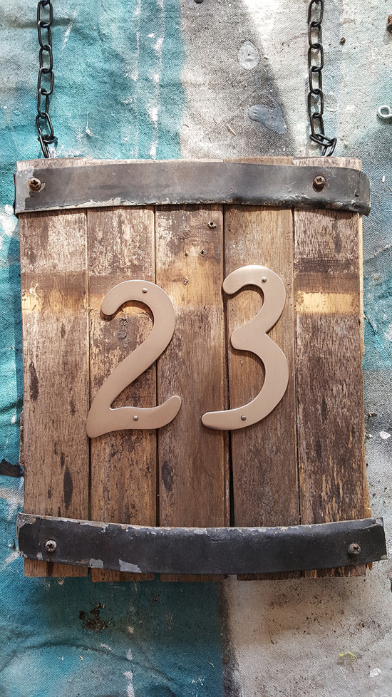 rustic house number sign