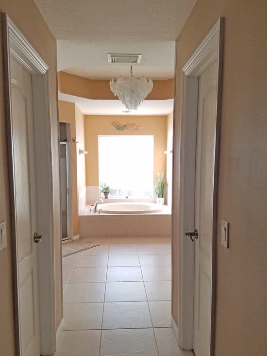 master bath with his and her closets