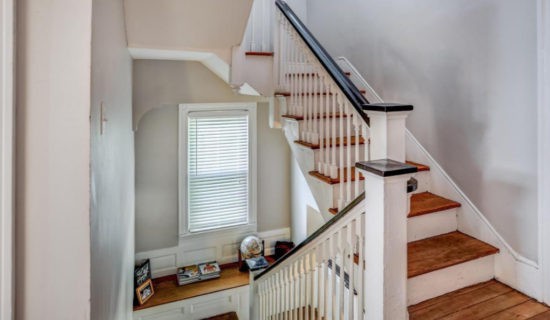 House Tour Staircase landing with window seat