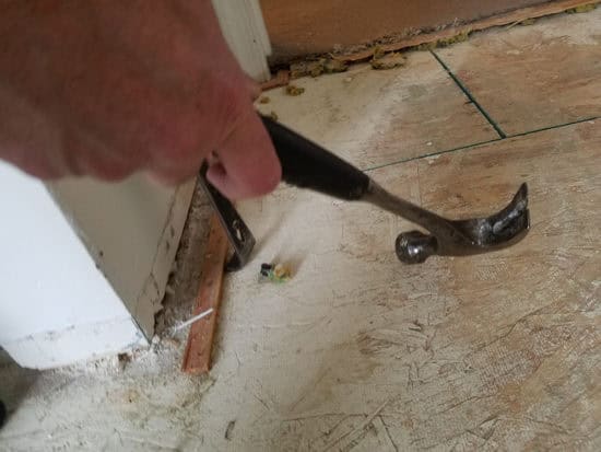 how to remove the tacky strips under carpets