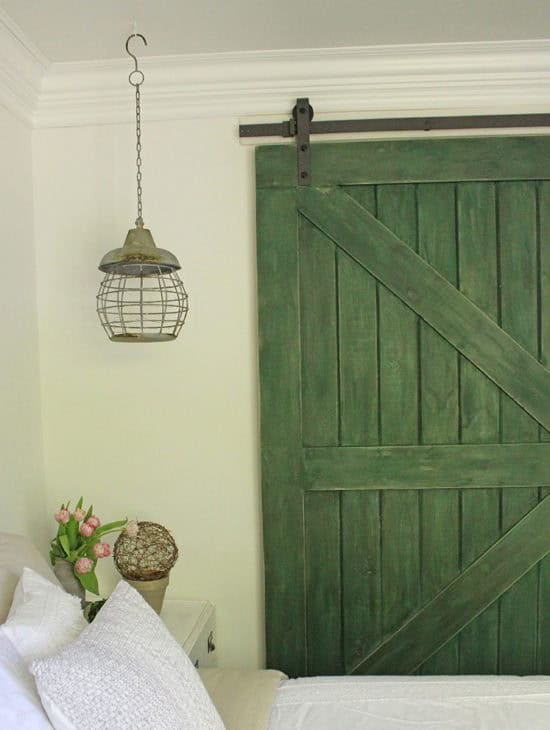 Bedroom Makeover, replace old closet doors with a DIY sliding barn door in farmhouse green.