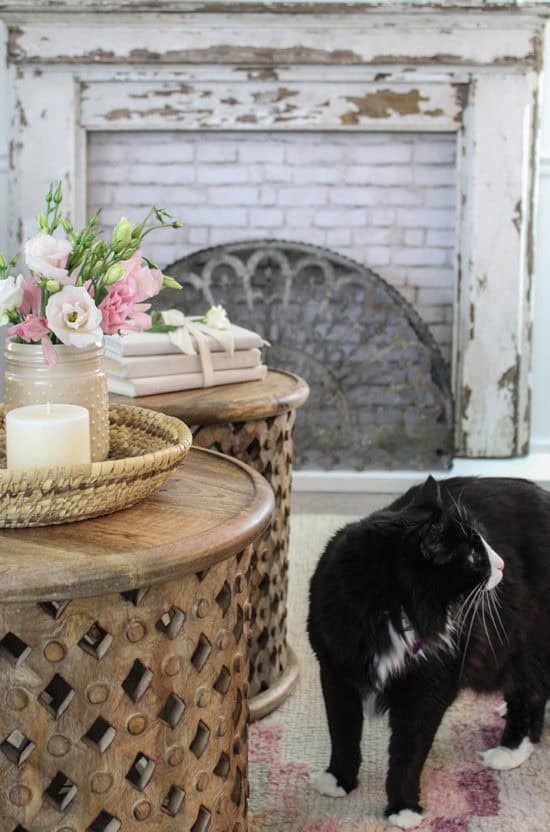 farmhouse living room with pink accents round coffee tables