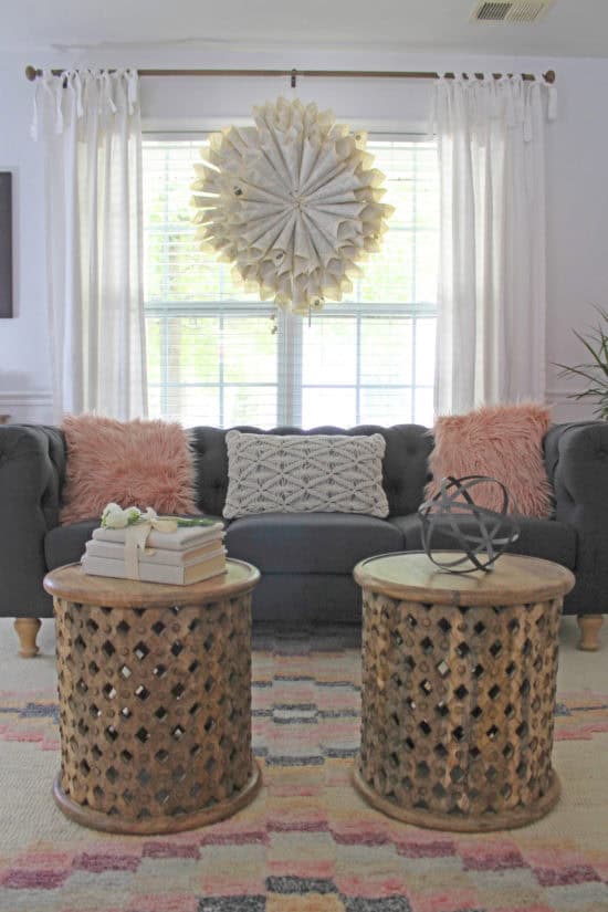 Living room with gray sofa and pink accents