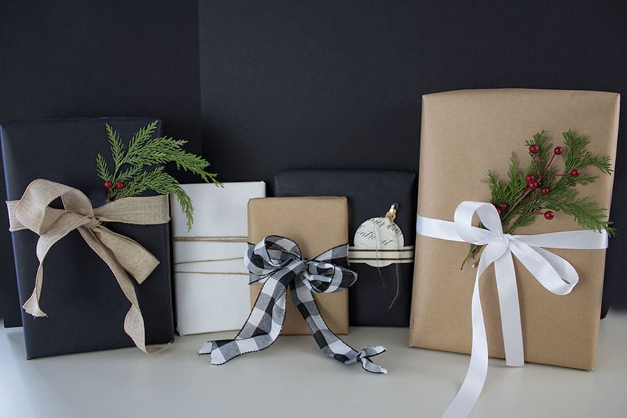 Premium Photo  Birthday presents decorated with wrapping paper and black  ribbon