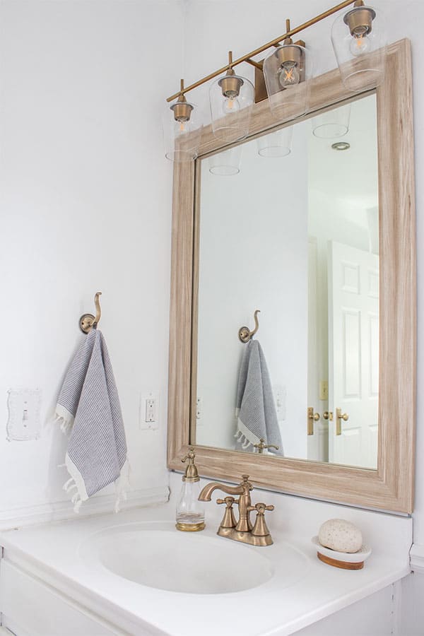 white-bathroom,-brass-accents,-painted-bathroom-sink,-white-sink-paint