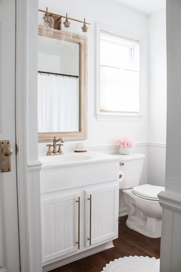 White Bathroom with Brass Accents The Home