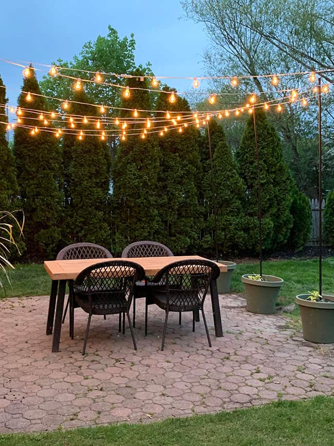 DIY Patio Arbor Using String Lights - The Honeycomb Home