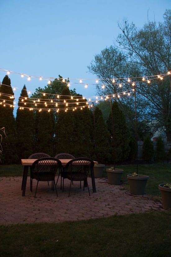 DIY Patio Arbor Using String Lights - The Honeycomb Home