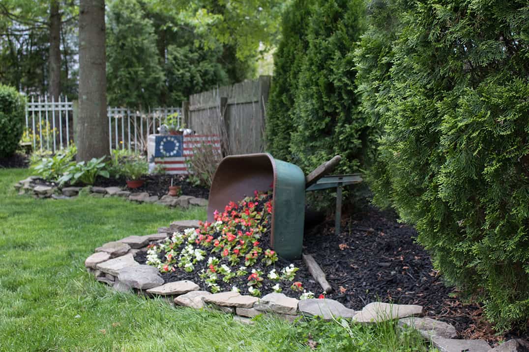 DIY Tipped Wheelbarrow Planter - The Honeycomb Home