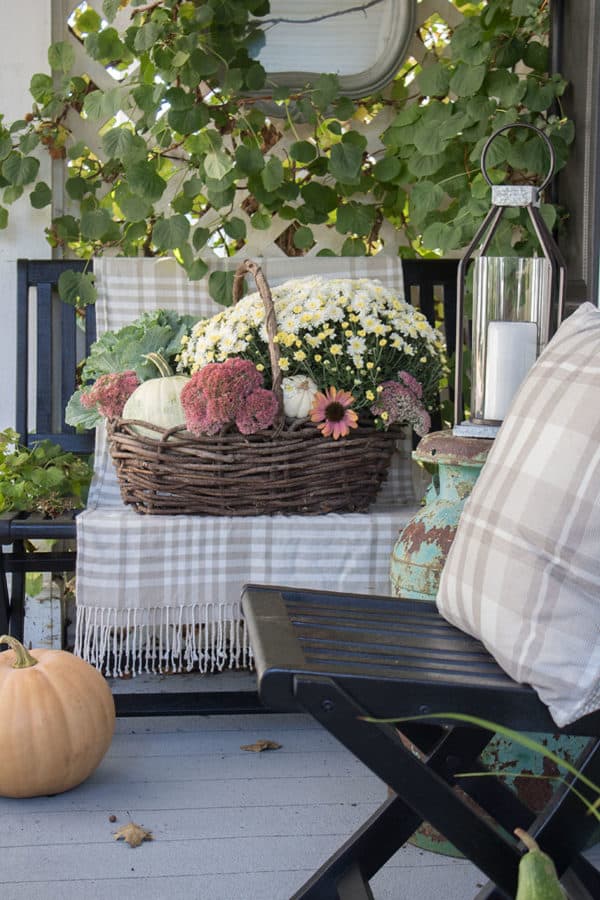 small front porch decorating ideas for fall with mirror and basket full of mums