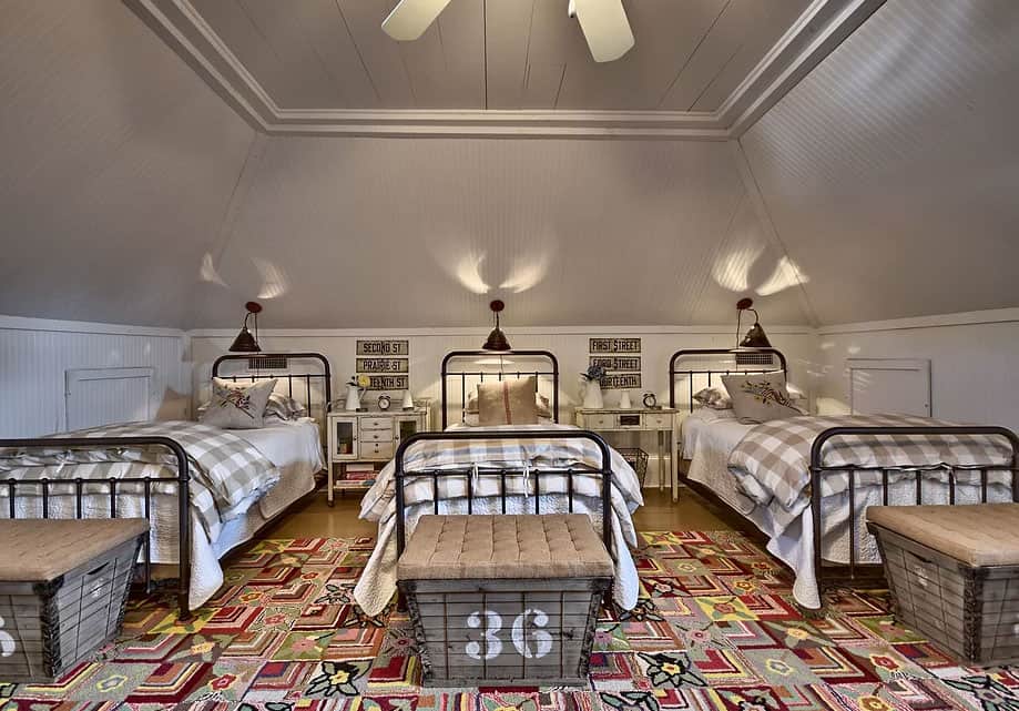 upstairs-bedroom-with-slanted-walls-and-shiplap-ceiling