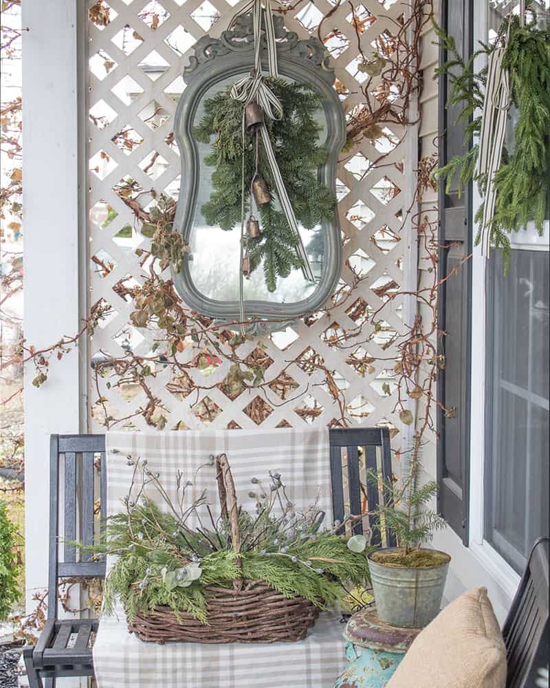 Outdoor mirror on porch, winter decorating exterior.