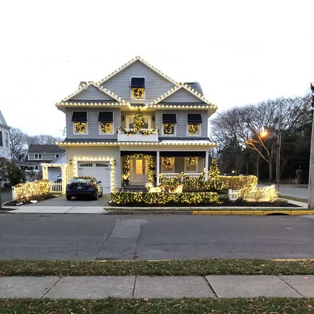 house with white christmas lights