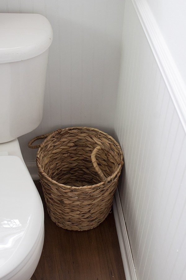 basket for garbage can in bathroom