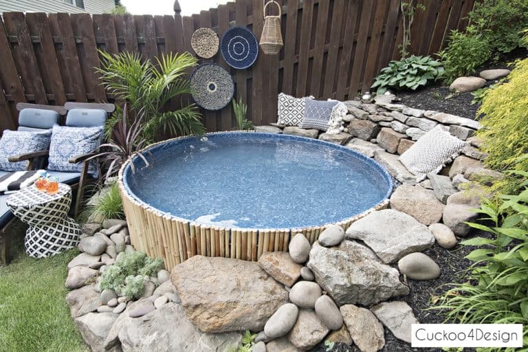 https://thehoneycombhome.com/wp-content/uploads/2020/07/stock-tank-swimming-pool-in-sloped-yard-with-pool-liner_8425-768x512-1.jpg