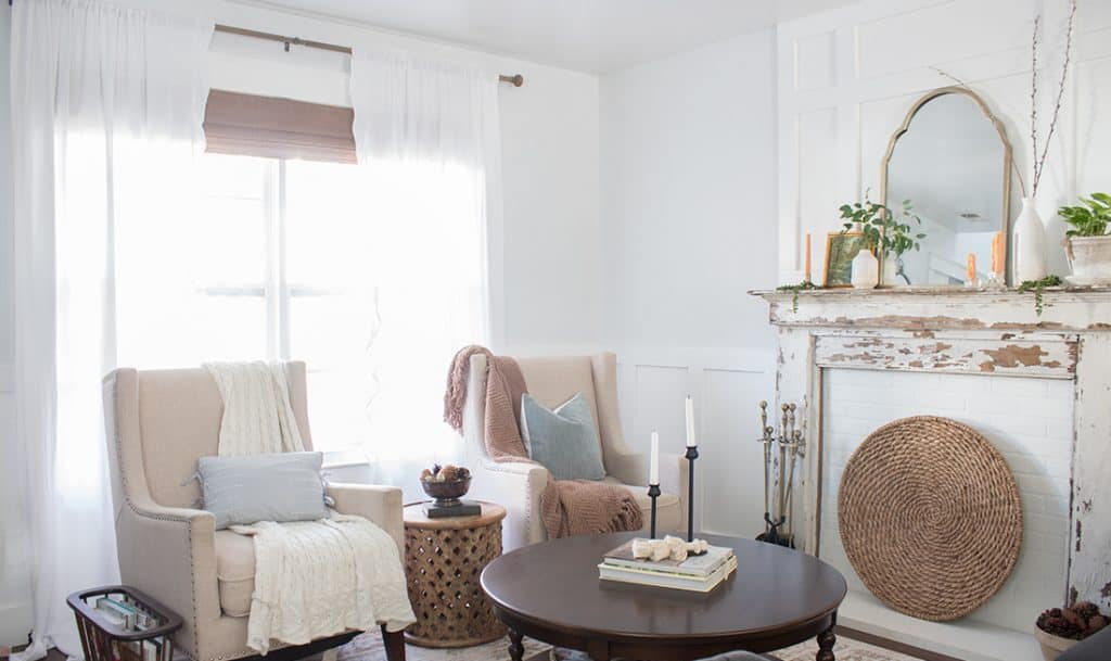 living room with fireplace and two side chairs