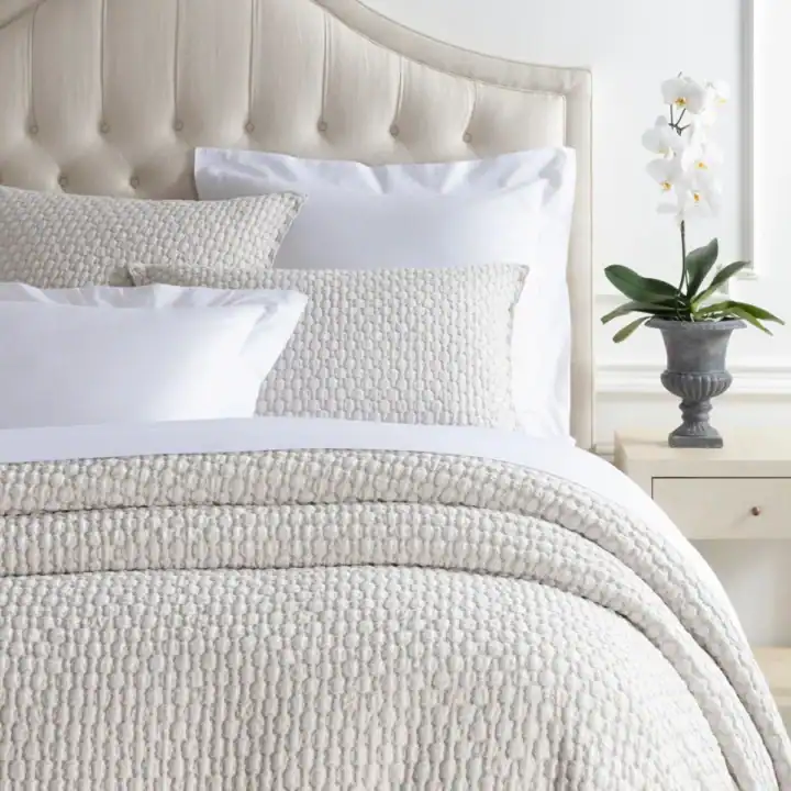 gorgeous tan and white bedding