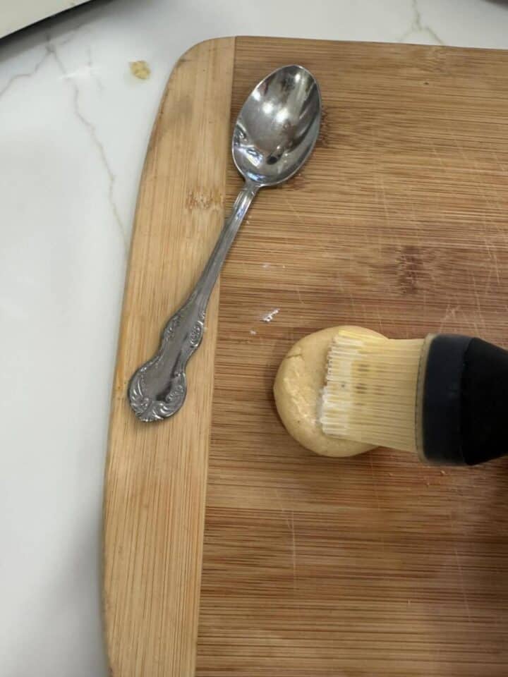 brush milk onto sugar cookies to get sanding sugar to stick