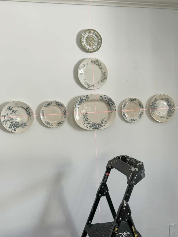using-a-level-to-hang-dishes-on-wall