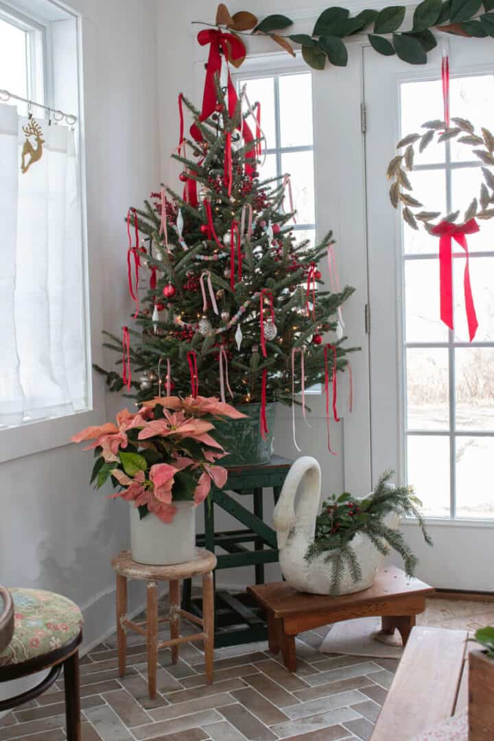 Sunroom-Christmas-tree with red and pink ribbon in a green vintage bucket
