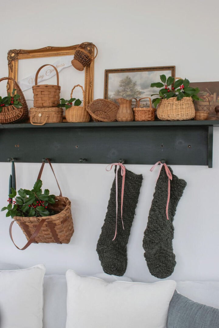 shelf-over-sunroom-sofa-filled-with-baskets-and-holly-berry-clipping-for-Christmas
