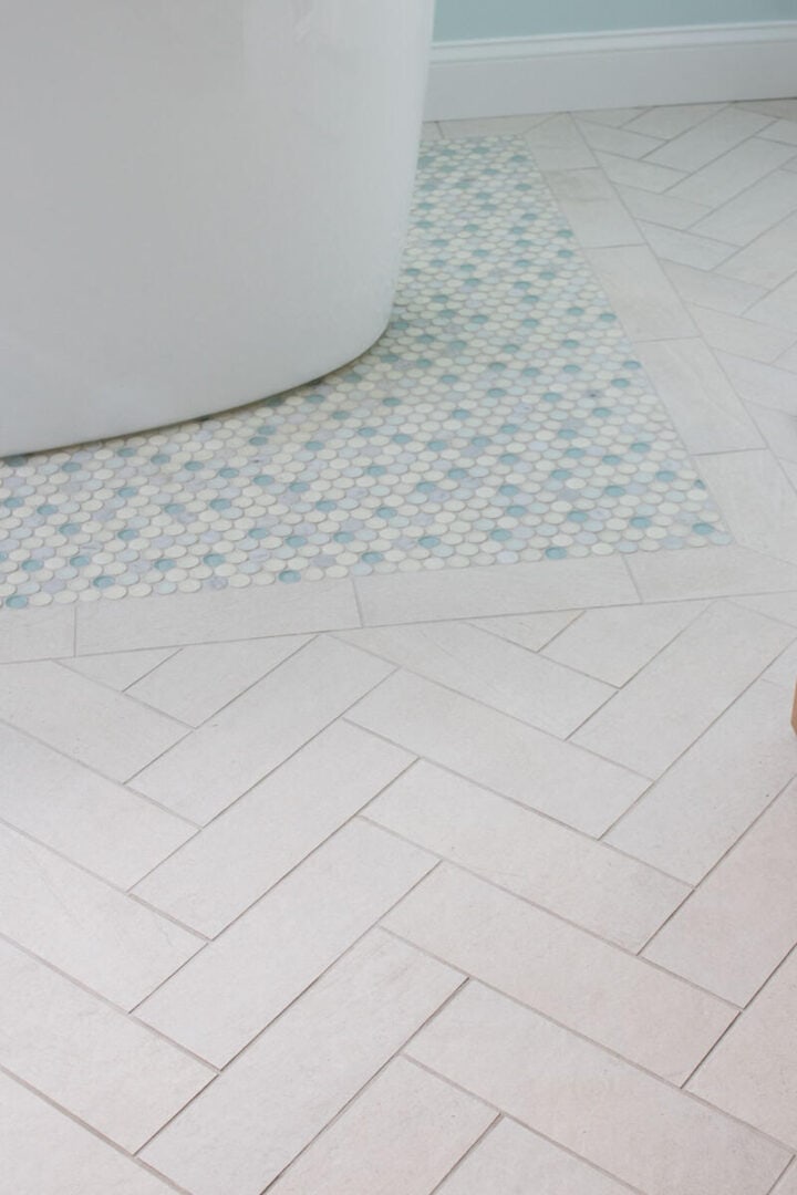 coastal-bathroom-with-herringbone-and-penny-tile-floor