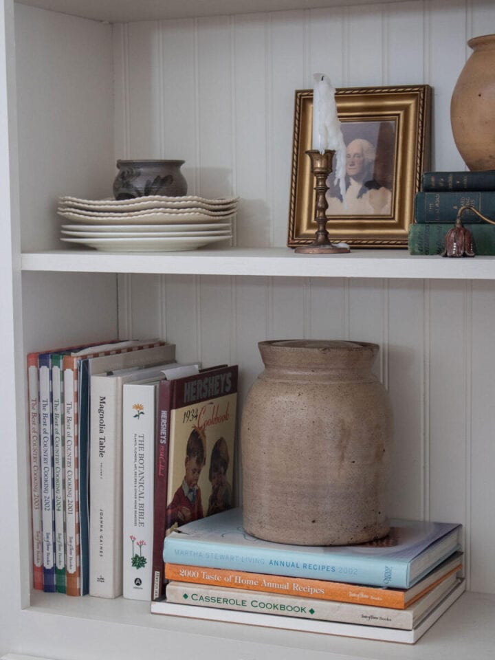 arranging-books-on-shelves - PRACTICAL TIPS ON HOW TO STYLE OPEN SHELVES
