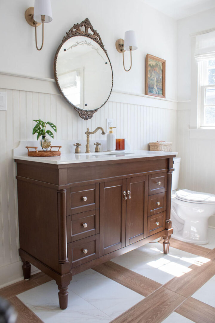 antique mirror over new vanity that looks old