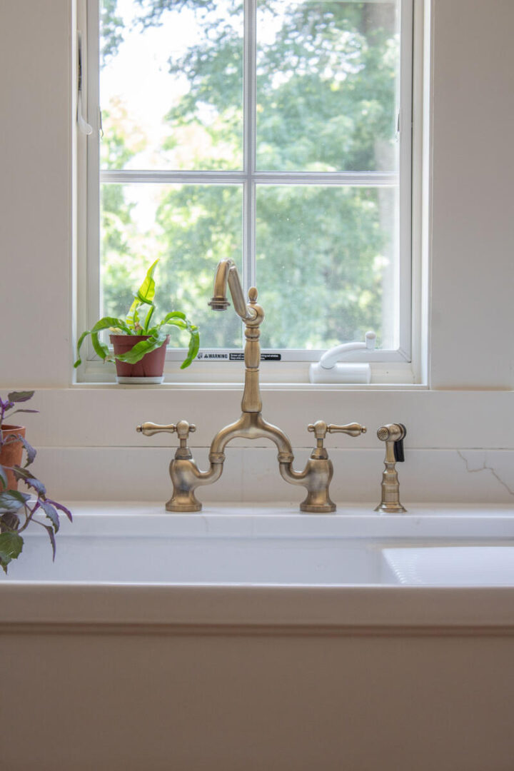 vintage brass antique style kitchen faucet - how to add historic charm to a home renovation